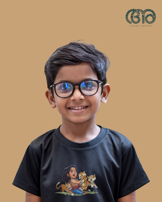 Young boy dressed in a black Manikanta Series T-shirt for Hindu prayers